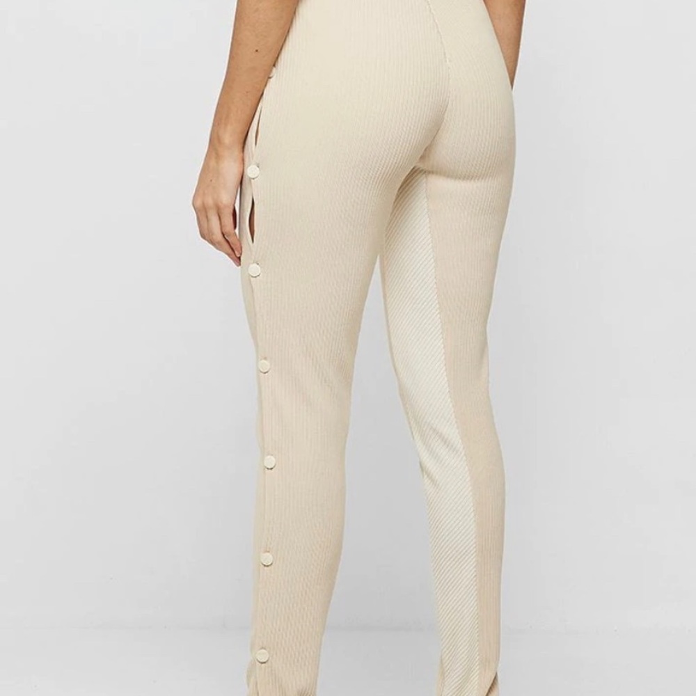 Size 4 pants, beige color, button down on the sides, can be dressed up or down